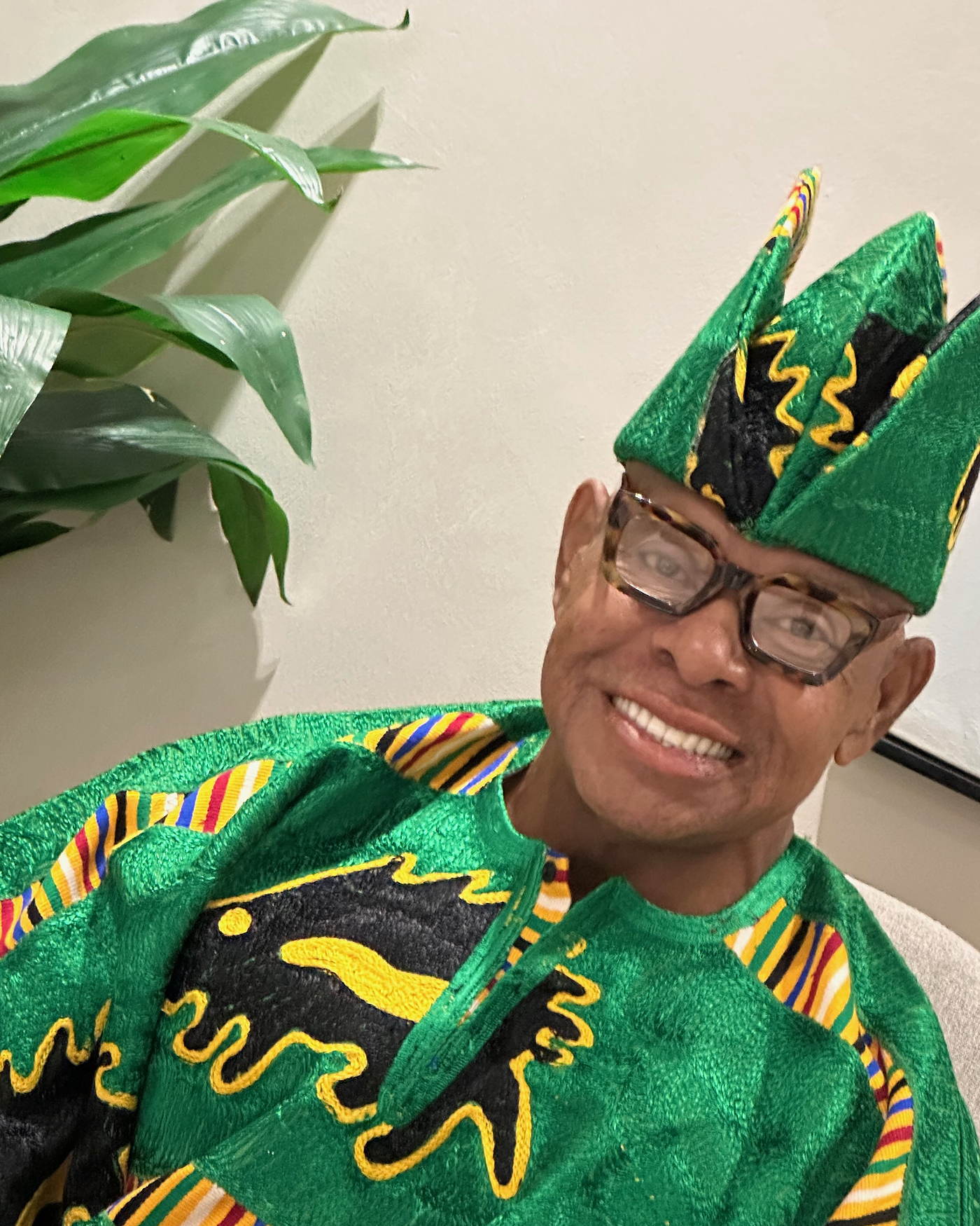 Rev. MacArthur H. Flournoy IV in a green agbada and cap