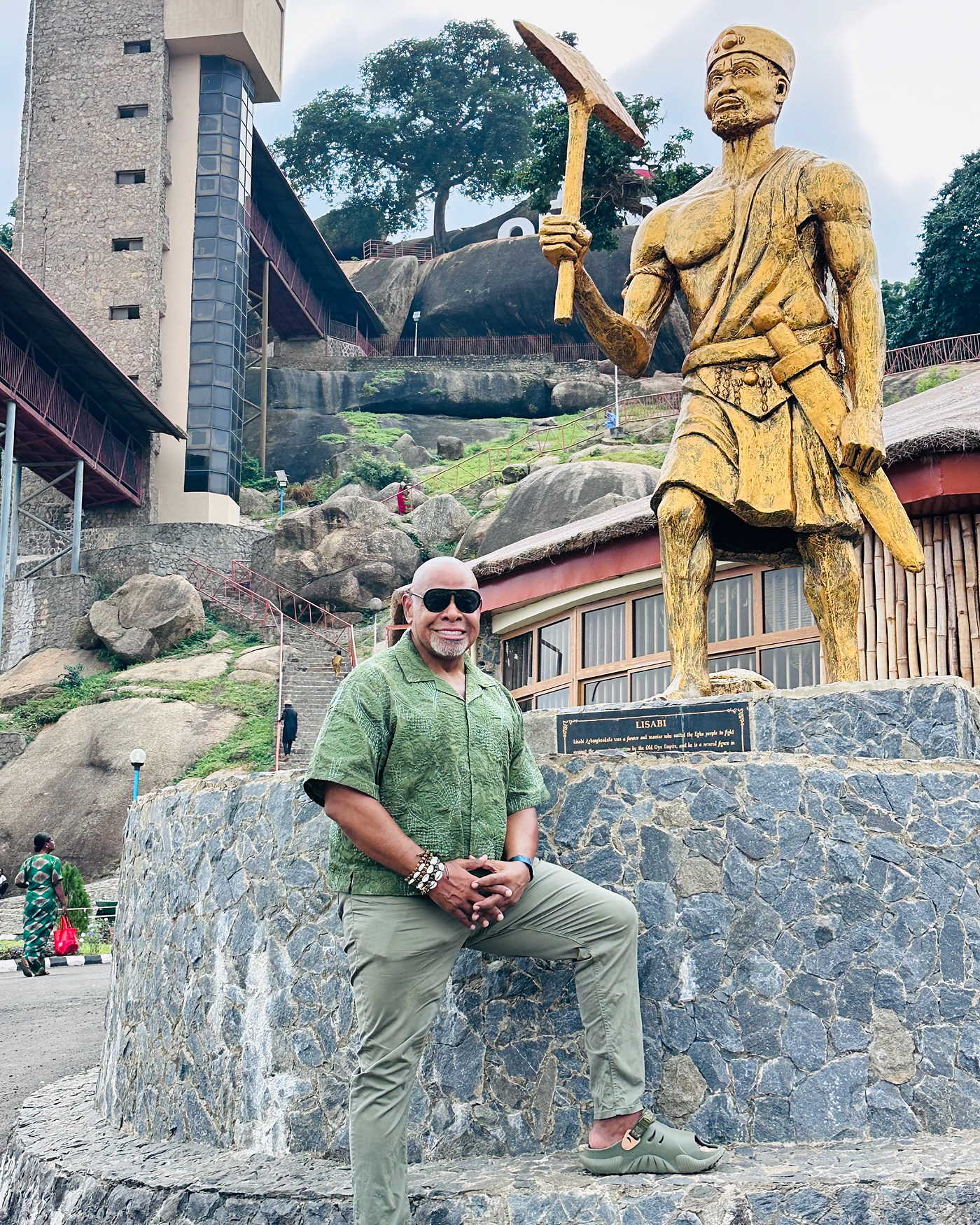 Rev. MacArthur H. Flournoy IV at the hunter statue at Olumo Rock, Abeokuta