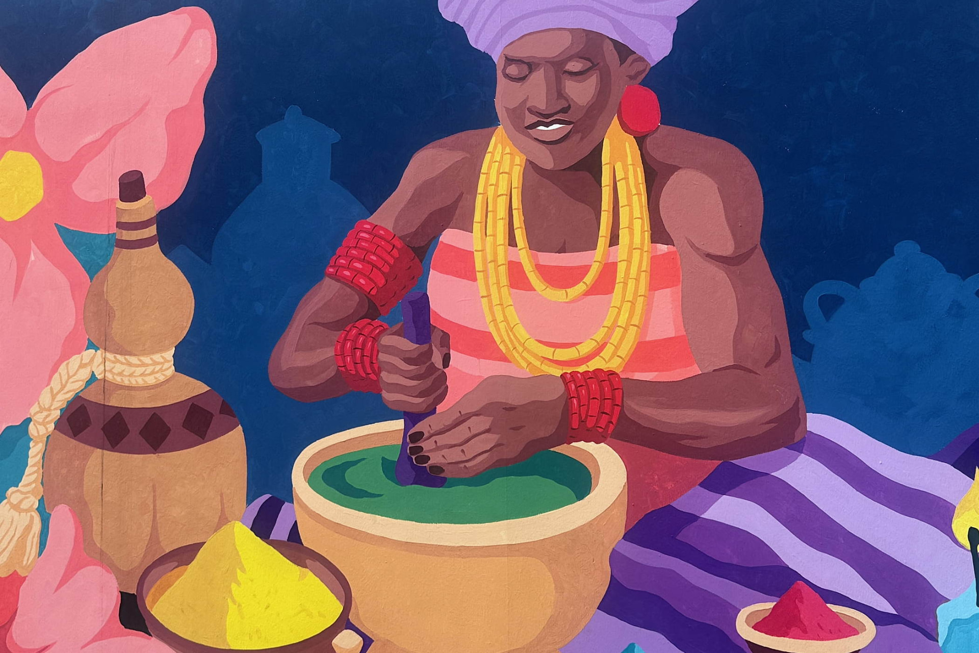 A street mural in Abeokuta, Nigeria, showing a woman preparing food in bright colour